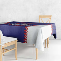 Blue baseball-style tablecloth with red/white stitched trim and hanging corner