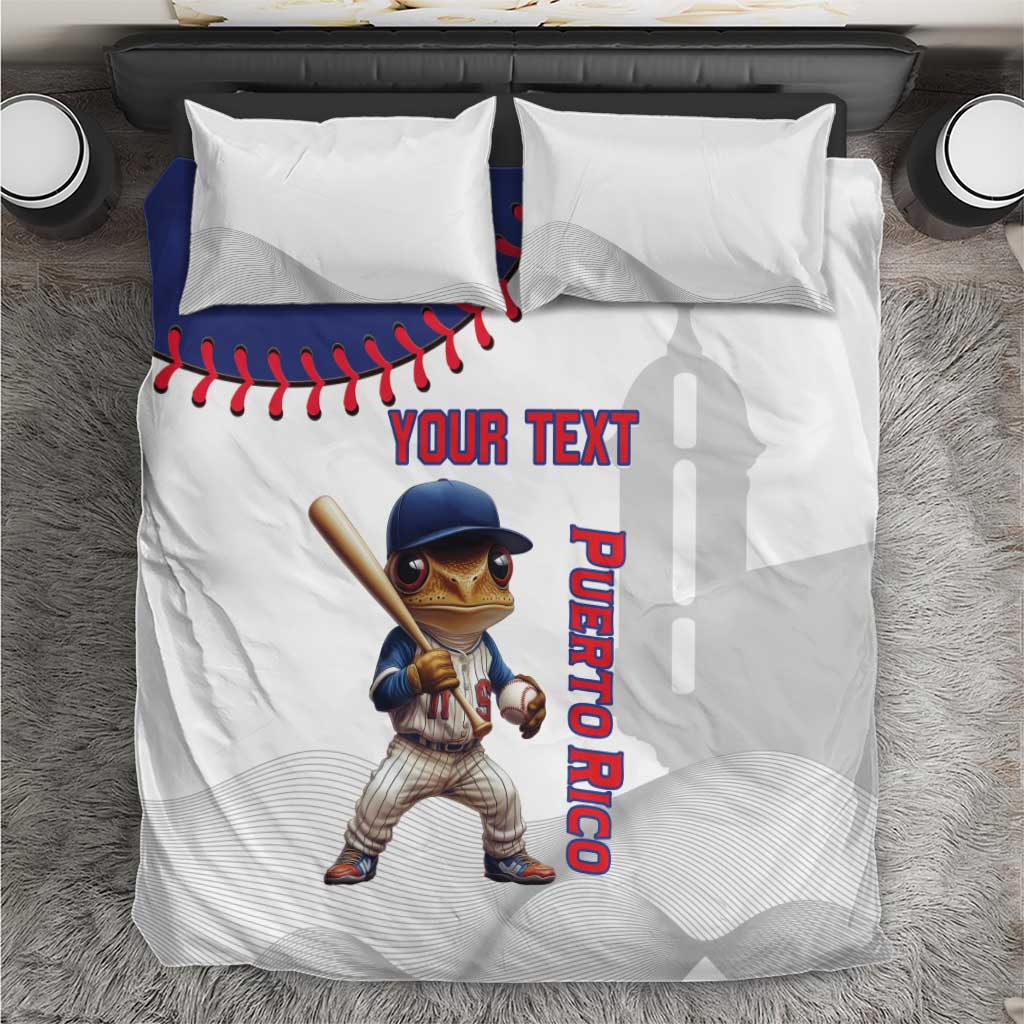 White baseball-style bedding set with Coqui mascot and red baseball stitching detail.