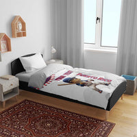 White baseball bedding set on bed with Coqui mascot graphic and Puerto Rico-themed design.