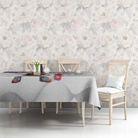 White tablecloth with baseball mascot pattern and red-blue Puerto Rico lettering on dining table.