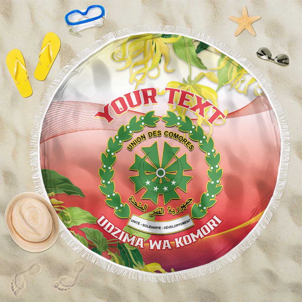 Round Comoros coat of arms beach blanket, red-pink circular print, white fringe border