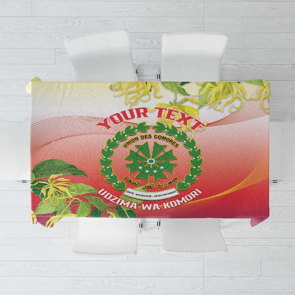 Personalized tablecloth with Comoros crest, red-purple gradient, and green ylang ylang floral