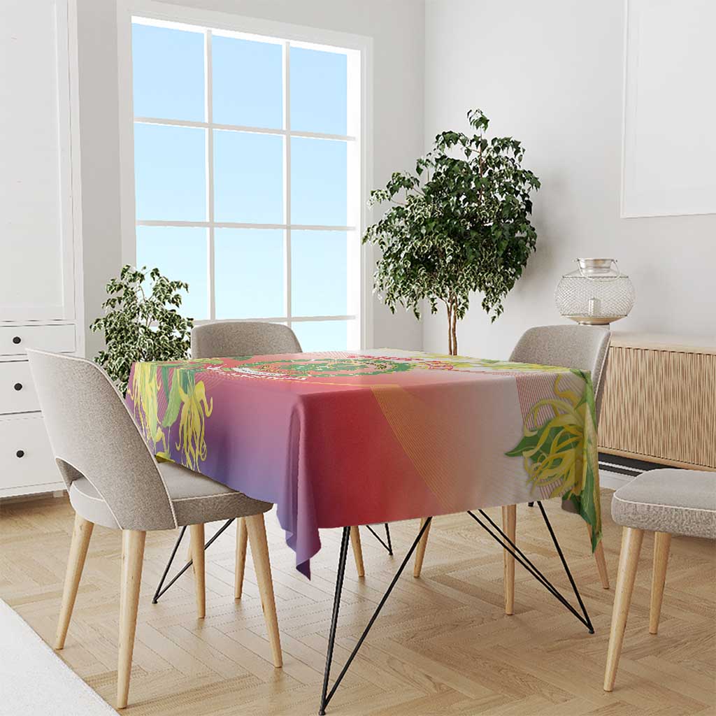 Red-purple tablecloth with green floral accents draped over a dining table