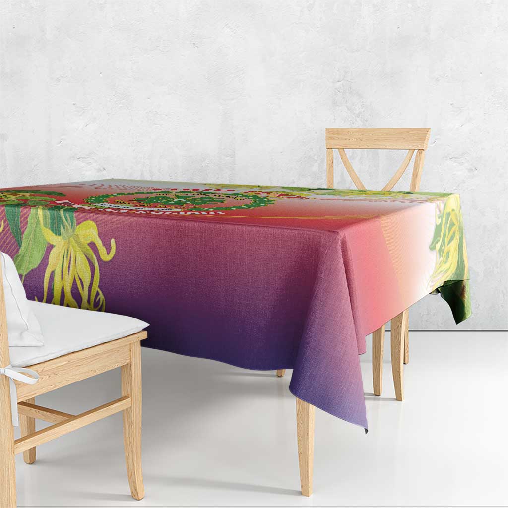 Close view of red and purple gradient tablecloth with green ylang ylang flower print