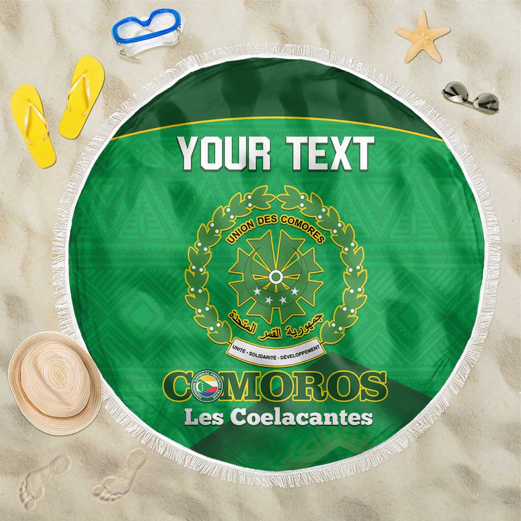 Green round football beach blanket with white fringe and circular crest print