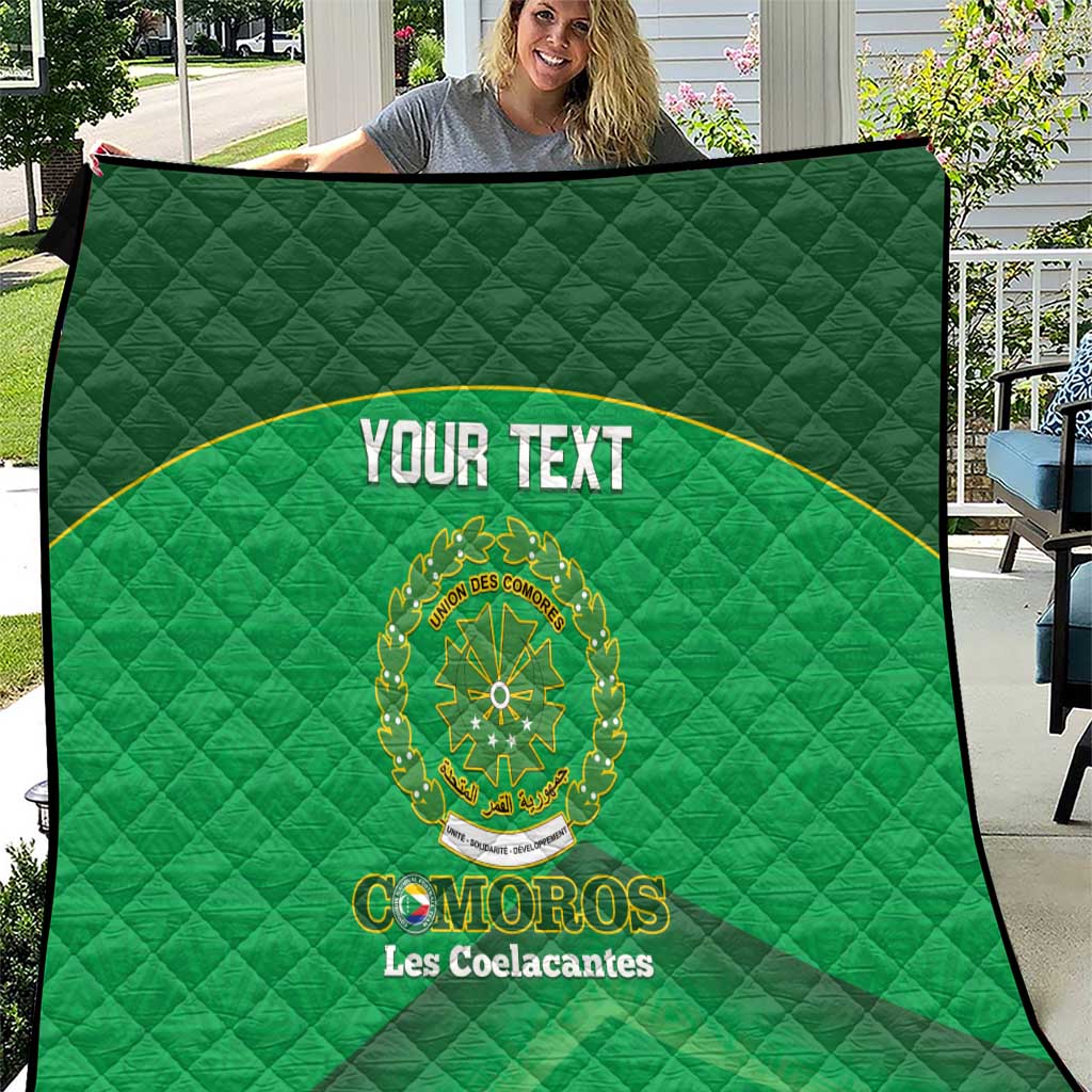 Custom green football quilt with diamond stitching, black trim, and “YOUR TEXT” emblem