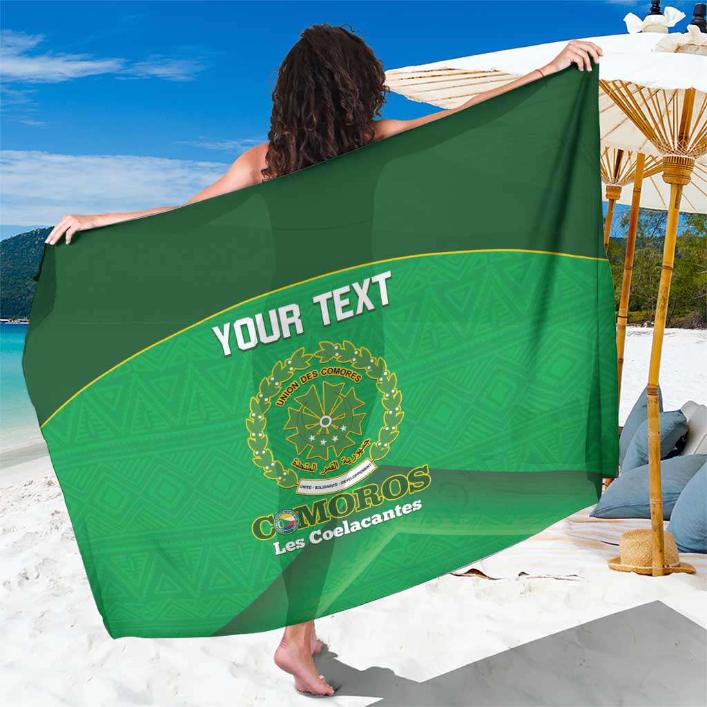 Green sarong spread wide, diagonal band with 'YOUR TEXT' and Comoros crest