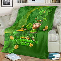 Green St. Patrick's Day blanket with leprechaun and shamrock graphics, 'Happy St. Patrick's Day' text