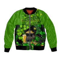 Green bomber jacket with front zipper and shamrock print, black ribbed cuffs and hem.