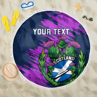 Navy and purple circular beach blanket with green thistle Scotland emblem and fringe edge