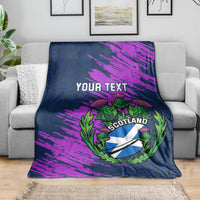 Navy rugby blanket draped on gray sofa, purple brush stripes with YOUR TEXT and Scotland thistle