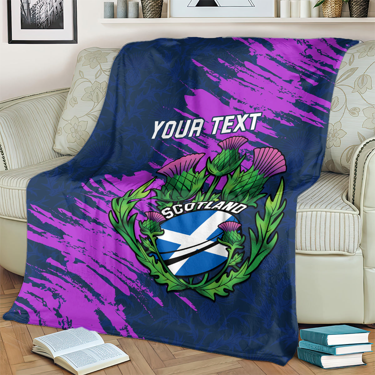 Navy rugby blanket on cream couch, purple brush design with YOUR TEXT and green Scotland thistle