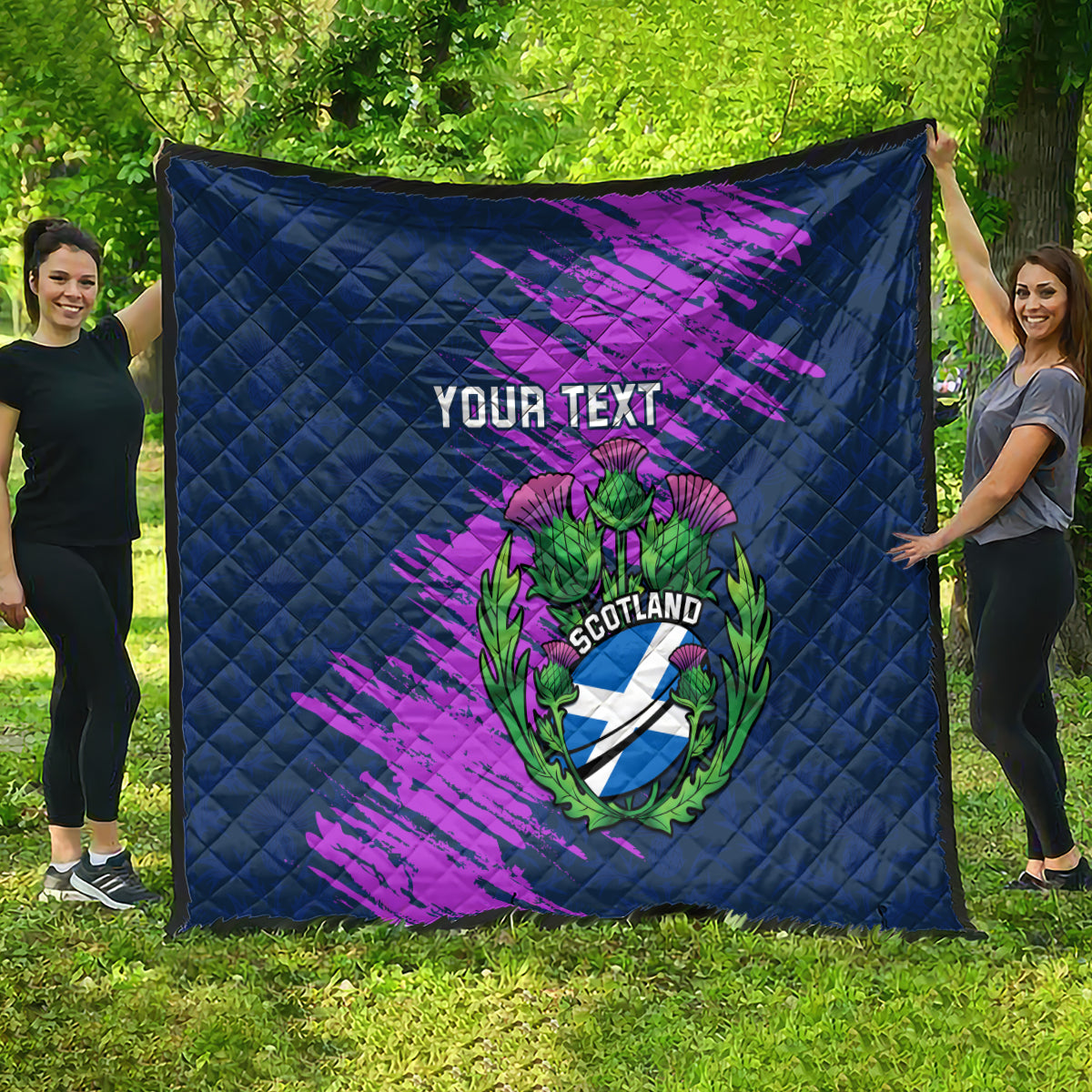 Navy blue quilt spread out with purple brush strokes and Scotland thistle crest, “Your Text”