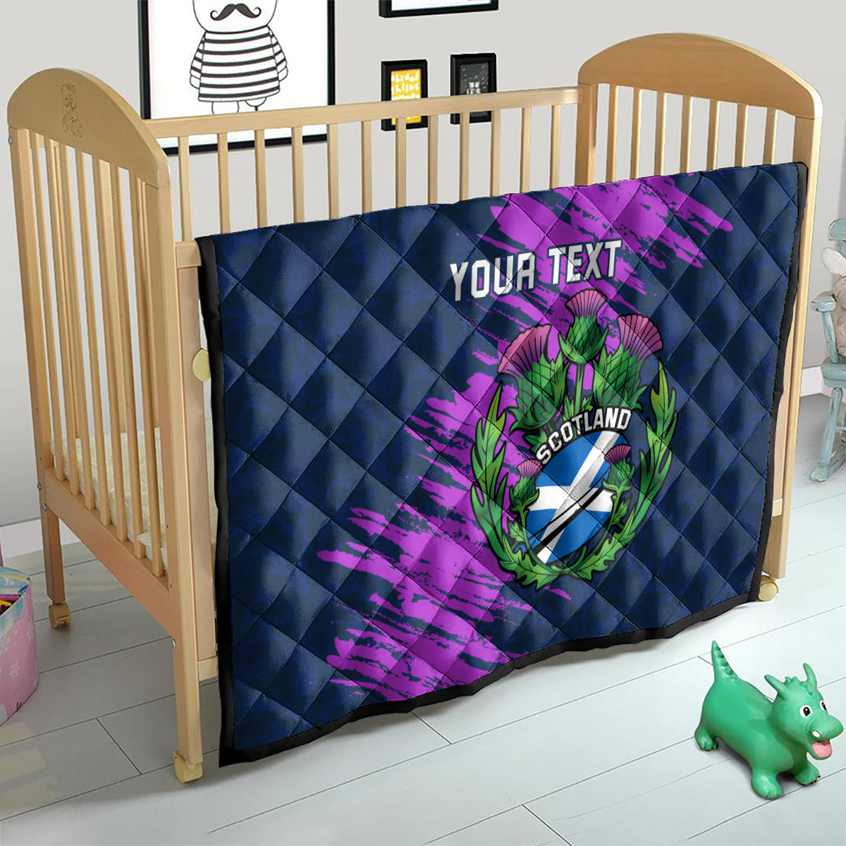 Navy blue quilt for crib with purple brush strokes and Scotland thistle crest, “Your Text”