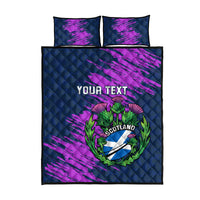 Navy quilt bed set with purple streak design, Scotland thistle crest, and two matching pillows