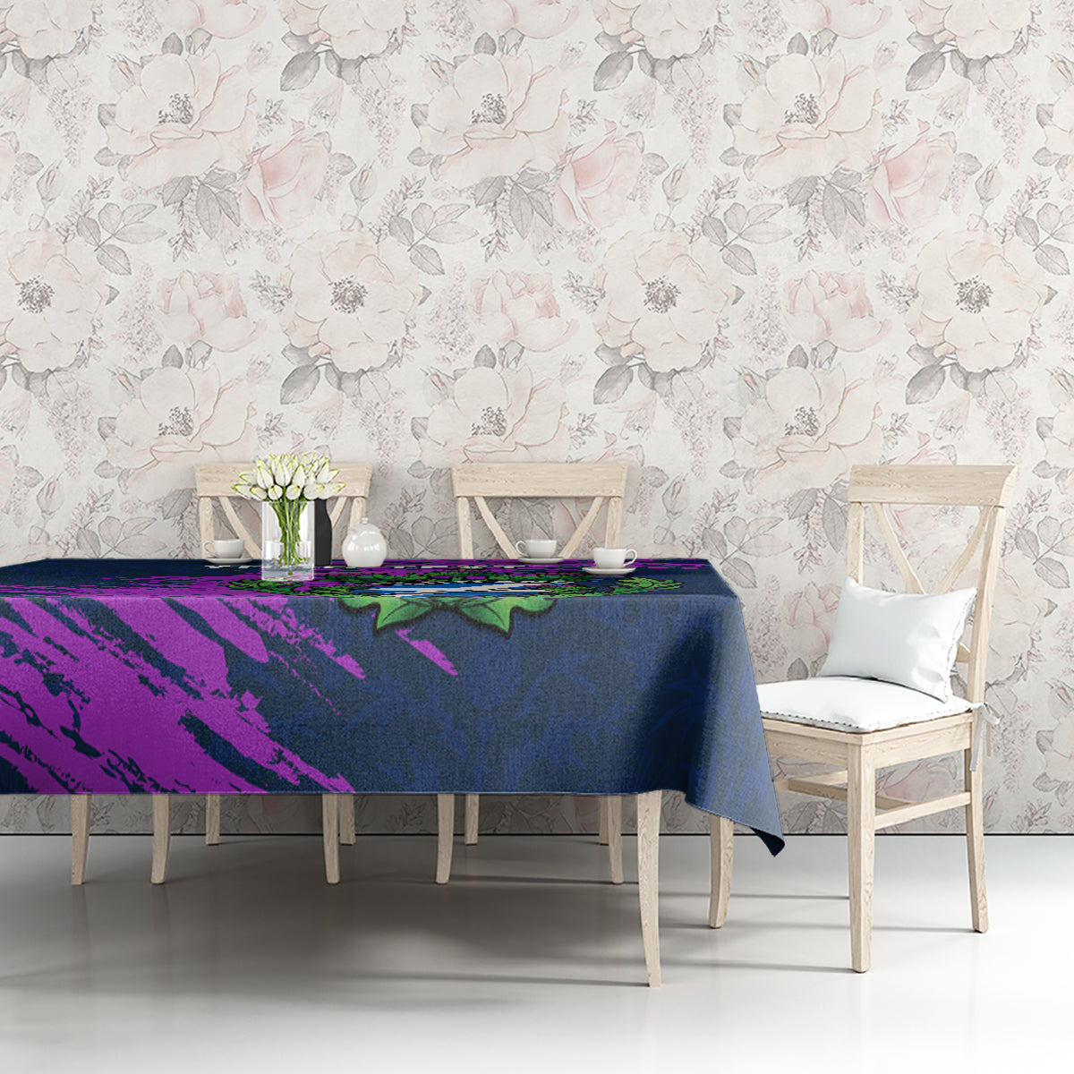 Navy blue tablecloth with purple and green thistle crest, covering table top