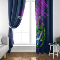 Navy blue window curtain panels with purple print and Scotland crest, tied near center