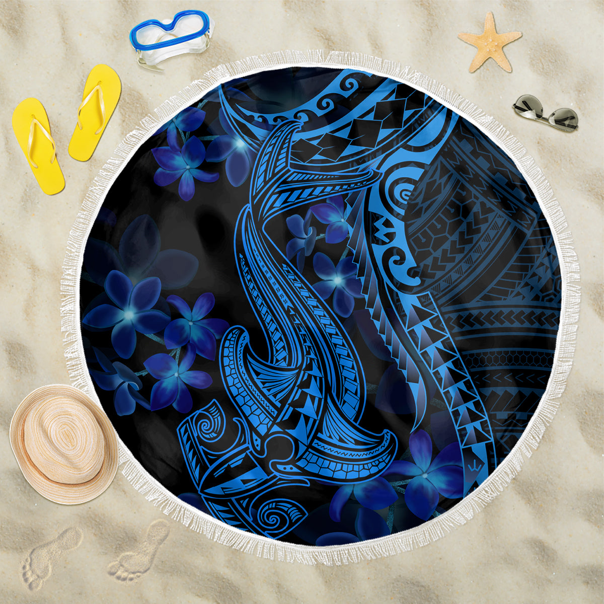 Blue round beach blanket with white fringe; tribal shark and plumeria flower design