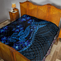Blue shark tattoo quilt with plumeria flowers spread on a bed with dark blue fabric