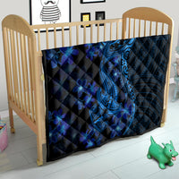 Blue shark tattoo quilt with blue plumeria flowers on a wooden crib