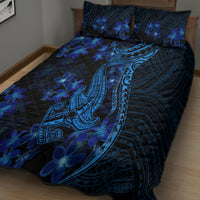 Blue quilt bed set with Polynesian shark tattoo motif and plumeria flowers on quilt and pillows