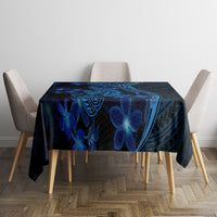 Blue Polynesian shark and flower tablecloth draped over a dining table