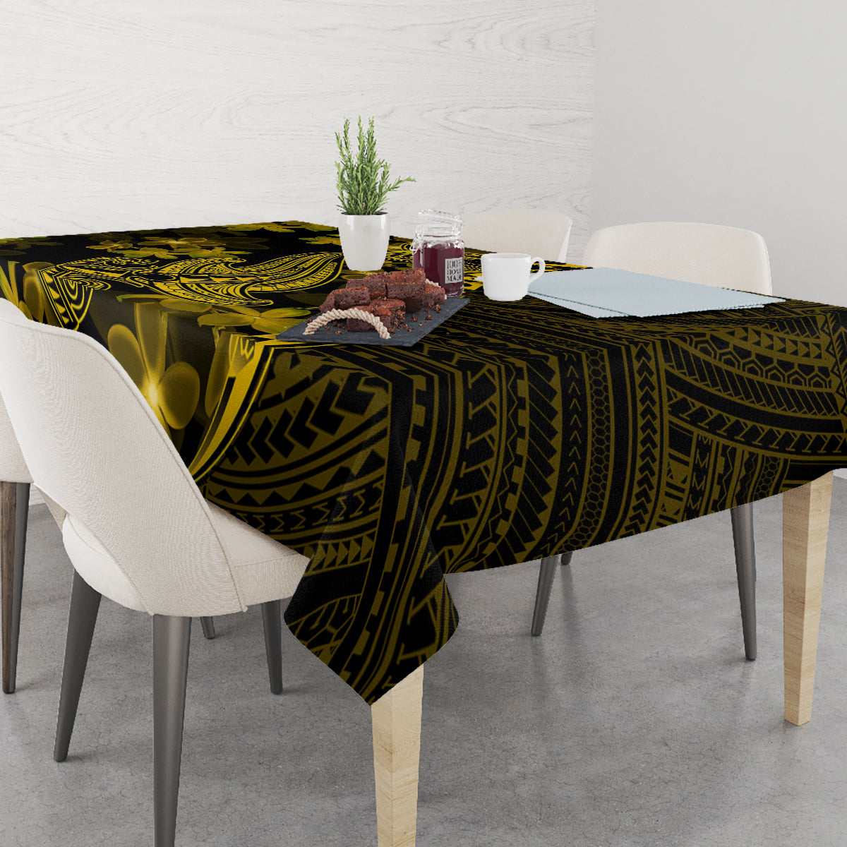 Dark tablecloth with gold Polynesian tribal design and plumeria flower motifs