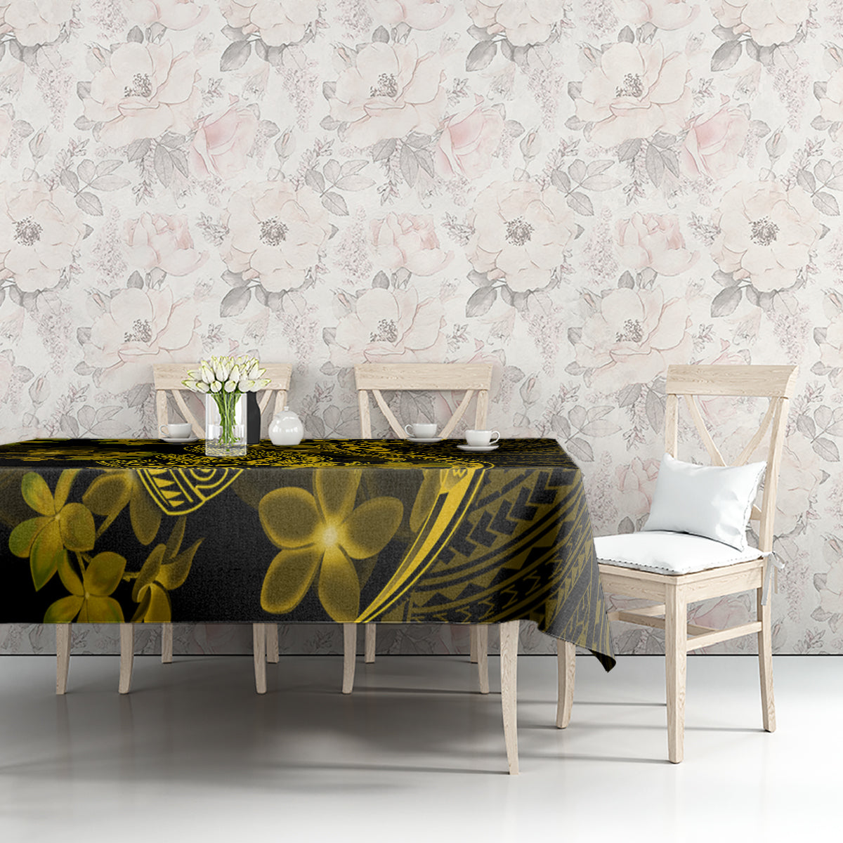 Dark tablecloth with gold plumeria flowers and tribal design on dining table