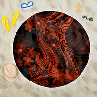 Round beach blanket with fringed white edge, black base with red/orange Polynesian shark art