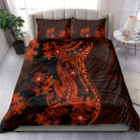 Polynesian bedding set on bed: black-red plumeria flowers and stylized shark tattoo design