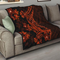 Quilt blanket on sofa: black with orange tribal shark tattoo and red floral motifs