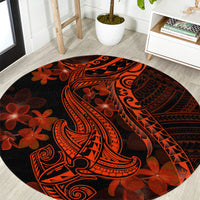Round rug with Polynesian shark tattoo and red-orange plumeria on dark background