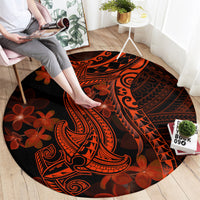 Round rug featuring Polynesian shark tattoo and red-orange flowers on dark base
