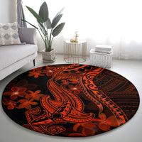 Round Polynesian-style rug with shark tattoo and plumeria motifs, dark with orange-red