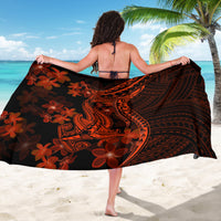 Black sarong with bold orange swirl tribal designs and large floral motif panel