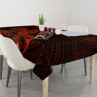 Polynesian tablecloth on dining table with dark black base, red plumeria and shark tattoo
