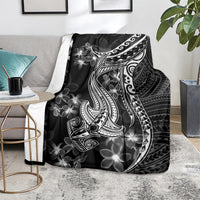 Black throw blanket showing white shark tattoo and Polynesian floral plumeria motifs