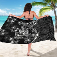 Black sarong draped with white shark tattoo, wave motifs, and polynesian floral