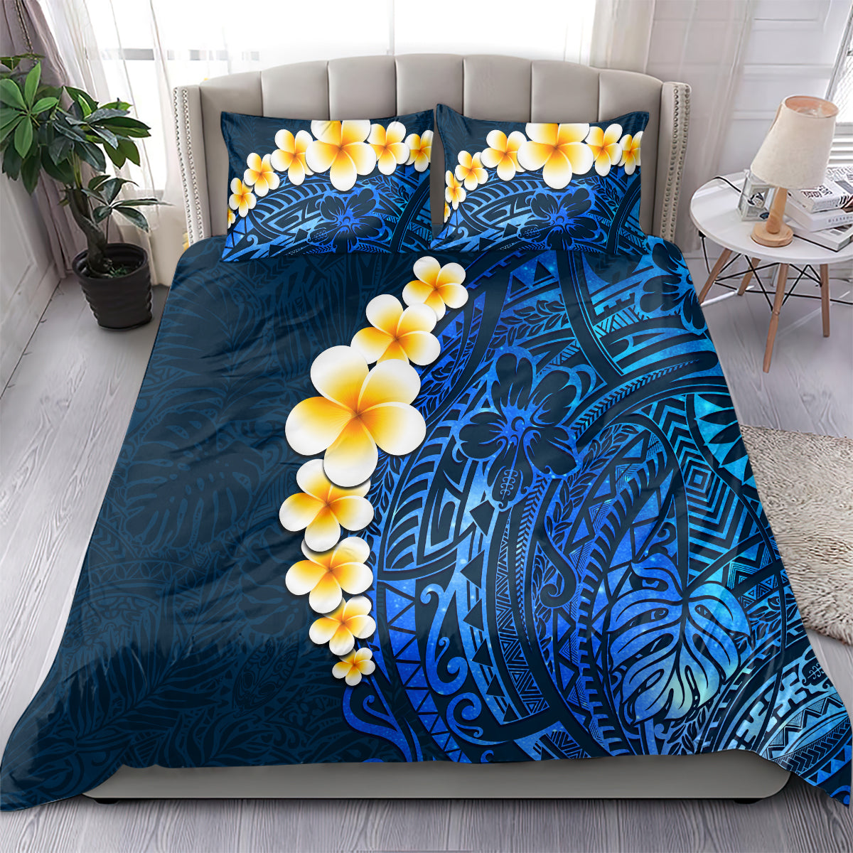 Blue bedding set with plumeria floral print, ornate tropical design across the duvet