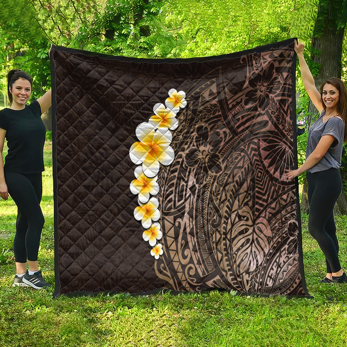 Brown quilt throw blanket laid outdoors, diamond quilting, plumeria blossoms and Polynesian motif