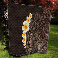 Brown quilted blanket with diagonal diamond pattern, plumeria flower row, Polynesian leaf artwork