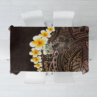 Brown tablecloth with tropical floral plumeria and leaf pattern, galaxy-style artwork.