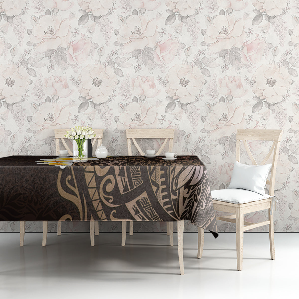 Brown tablecloth with Polynesian leaf and geometric artwork, styled on rectangular table.