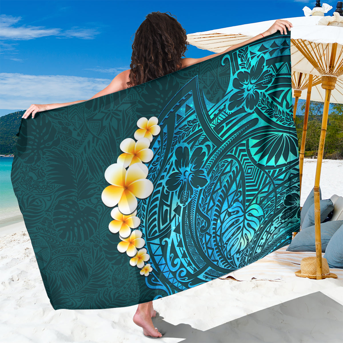 Turquoise polynesian sarong with ornate leaf print and plumeria flower design
