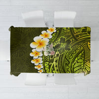 Lime green tablecloth with white plumeria flowers and dark geometric Polynesian patterns