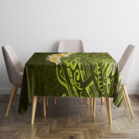 Lime green tablecloth with stylized geometric Polynesian pattern and yellow plumeria, corner view