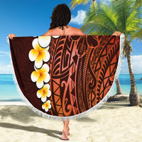 Round beach blanket with red Polynesian design and large plumeria flower print, white fringe
