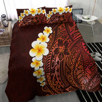 Red tropical comforter and pillowcases featuring large yellow plumeria and tribal motifs