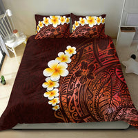Red bedding set with yellow plumeria flowers and dark tribal pattern across comforter