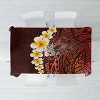 Red tablecloth with plumeria flowers and Polynesian tribal geometric pattern